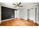 Spacious bedroom with hardwood flooring, closet and ceiling fan at 215 Collum Nw St, Atlanta, GA 30314
