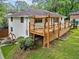 The home features a spacious wooden deck with wooden railings, offering ample outdoor living space at 215 Collum Nw St, Atlanta, GA 30314