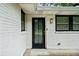 Close-up of the exterior of the home showcasing the door, lighting, and painted brick at 215 Collum Nw St, Atlanta, GA 30314