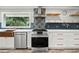 Elegant kitchen offers stainless steel appliances, copper fixtures and plenty of counter space at 215 Collum Nw St, Atlanta, GA 30314
