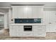 Beautiful kitchen island features a microwave, white cabinets, and ample counter space at 215 Collum Nw St, Atlanta, GA 30314