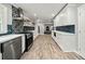 Contemporary kitchen features white cabinets, stainless appliances, and an open concept design at 215 Collum Nw St, Atlanta, GA 30314