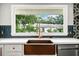 Close-up of kitchen sink with window views of the yard at 215 Collum Nw St, Atlanta, GA 30314