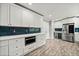 Bright kitchen with stainless steel refrigerator, microwave and white cabinets at 215 Collum Nw St, Atlanta, GA 30314