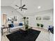 Open-concept living room showcasing fireplace and outdoor access via glass doors at 215 Collum Nw St, Atlanta, GA 30314