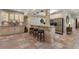 Basement wet bar with painted cabinets, seating, and stainless steel appliances at 2160 Bradley Trl, Cumming, GA 30041