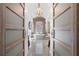 Elegant bathroom with vaulted ceilings, stand alone tub, chandelier, and stylish sliding doors at 2160 Bradley Trl, Cumming, GA 30041
