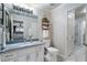Bathroom with marble floors, granite countertops, and glass door shower at 2160 Bradley Trl, Cumming, GA 30041
