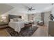 Inviting bedroom features a ceiling fan, hardwood floors, and neutral paint at 2160 Bradley Trl, Cumming, GA 30041