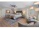 Inviting bedroom features a ceiling fan, hardwood floors, and neutral paint at 2160 Bradley Trl, Cumming, GA 30041