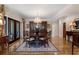 Elegant dining room featuring hardwood floors, chandelier, and china cabinet at 2160 Bradley Trl, Cumming, GA 30041
