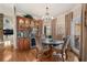 Cozy dining room featuring natural light, bar, and hardwood flooring at 2160 Bradley Trl, Cumming, GA 30041