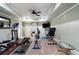 Well-equipped exercise room with various machines, a ceiling fan, and ample space for workouts at 2160 Bradley Trl, Cumming, GA 30041