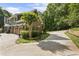 Beautiful home with stone and siding, a three-car garage, a circular driveway and professional landscaping at 2160 Bradley Trl, Cumming, GA 30041