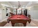 Spacious game room featuring a classic pool table with elegant lighting at 2160 Bradley Trl, Cumming, GA 30041