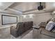 Luxurious home theater with plush seating, large screen, and immersive audio-visual experience at 2160 Bradley Trl, Cumming, GA 30041