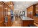 Gourmet kitchen with wood cabinetry, a center island, and stainless steel appliances at 2160 Bradley Trl, Cumming, GA 30041