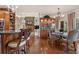 Gourmet kitchen with stainless appliances, wood cabinets, and hardwood flooring at 2160 Bradley Trl, Cumming, GA 30041