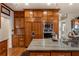 Well-equipped kitchen with custom cabinets, stone countertops, and modern stainless steel appliances at 2160 Bradley Trl, Cumming, GA 30041