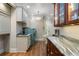 Laundry room features built-in cabinets, granite countertops, and stainless steel washer and dryer at 2160 Bradley Trl, Cumming, GA 30041