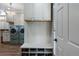 Well-organized laundry room with modern washer and dryer, ample cabinet space, and convenient mudroom features at 2160 Bradley Trl, Cumming, GA 30041