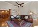 Comfortable living area with a plush leather sectional, hardwood floors, and elegant decor at 2160 Bradley Trl, Cumming, GA 30041