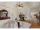 Spacious main bedroom features a fireplace, tray ceilings, hardwood floors, and sitting area at 2160 Bradley Trl, Cumming, GA 30041