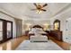 Spacious main bedroom features a tray ceiling, hardwood floors, and a sitting area at 2160 Bradley Trl, Cumming, GA 30041