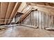 Unfinished attic with wooden beams, insulation, and potential for storage or future living space at 3253 Brookshire Way, Duluth, GA 30096