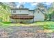 The backyard of the home has a deck and ample lawn space at 3253 Brookshire Way, Duluth, GA 30096