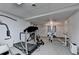 Finished basement gym with treadmill and weightlifting equipment; access to walk-out doors at 3253 Brookshire Way, Duluth, GA 30096