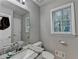 Well-lit bathroom features a marble countertop and vanity with plenty of space at 3253 Brookshire Way, Duluth, GA 30096
