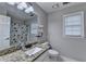 Bathroom features a large mirror, granite countertop, and a shower with decorative curtain at 3253 Brookshire Way, Duluth, GA 30096