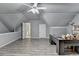 Spacious bonus room with grey flooring, grey walls, and a built-in desk at 3253 Brookshire Way, Duluth, GA 30096