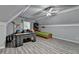 Bonus room is spacious with grey plank floors, grey paint, and a built-in desk at 3253 Brookshire Way, Duluth, GA 30096