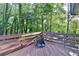 Relaxing deck area with a firepit and lush green surroundings at 3253 Brookshire Way, Duluth, GA 30096