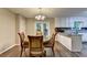 Light-filled dining area featuring a glass table with wood chairs at 3253 Brookshire Way, Duluth, GA 30096