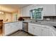Kitchen featuring white cabinets, stainless steel appliances, hardwood floors, and light at 3253 Brookshire Way, Duluth, GA 30096