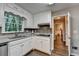 Kitchen with white cabinets, grey countertop, stainless appliances, and hardwood flooring at 3253 Brookshire Way, Duluth, GA 30096