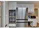 Kitchen with stainless appliances, stainless refrigerator, and white cabinets at 3253 Brookshire Way, Duluth, GA 30096