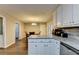 Kitchen with stainless dishwasher, dining area, hardwood floors, and lots of light at 3253 Brookshire Way, Duluth, GA 30096
