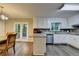 Bright kitchen with stainless steel appliances and gray and white backsplash at 3253 Brookshire Way, Duluth, GA 30096