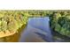 Scenic lake view surrounded by verdant trees, creating a peaceful and picturesque setting at 3253 Brookshire Way, Duluth, GA 30096