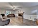 Spacious living room with hardwood floors, fireplace, and sliding glass doors at 3253 Brookshire Way, Duluth, GA 30096