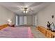 Spacious main bedroom with a ceiling fan, neutral paint, and a comfortable carpet at 3253 Brookshire Way, Duluth, GA 30096