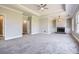 Expansive bedroom featuring neutral carpet, a ceiling fan, fireplace, and natural light at 489 Carter Se Ave, Atlanta, GA 30317