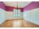 Dining room with hardwood floors, wainscoting, and a chandelier at 489 Carter Se Ave, Atlanta, GA 30317