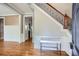 Elegant foyer featuring hardwood floors, wainscoting, and a staircase with iron spindles at 489 Carter Se Ave, Atlanta, GA 30317