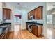 Well-equipped kitchen with dark wood cabinets, stainless steel appliances, and hardwood flooring at 489 Carter Se Ave, Atlanta, GA 30317
