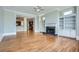 Spacious living room featuring hardwood floors, fireplace with built-ins, and easy access to the kitchen at 489 Carter Se Ave, Atlanta, GA 30317